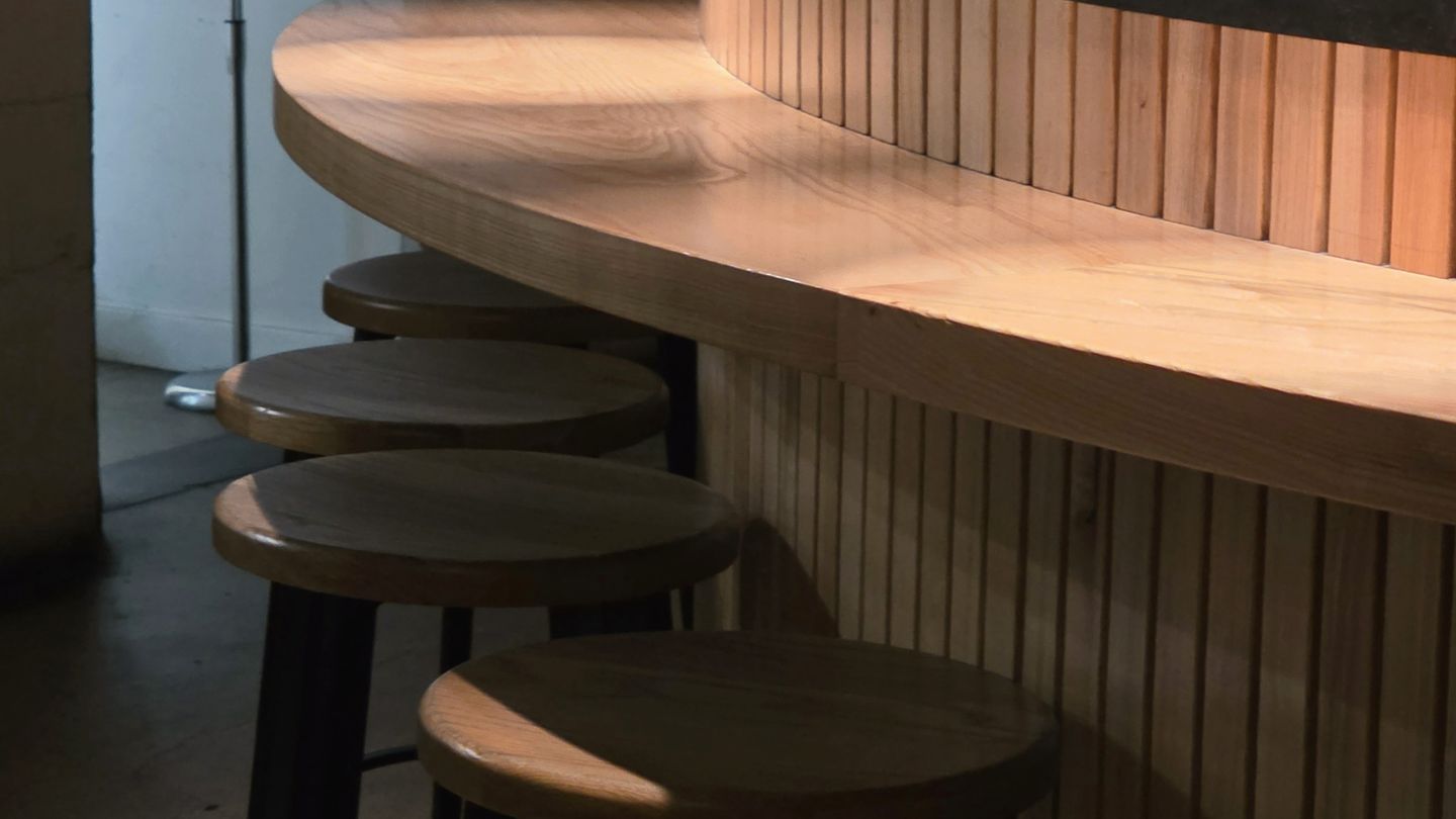Illustrative image: an empty cafe counter in morning light