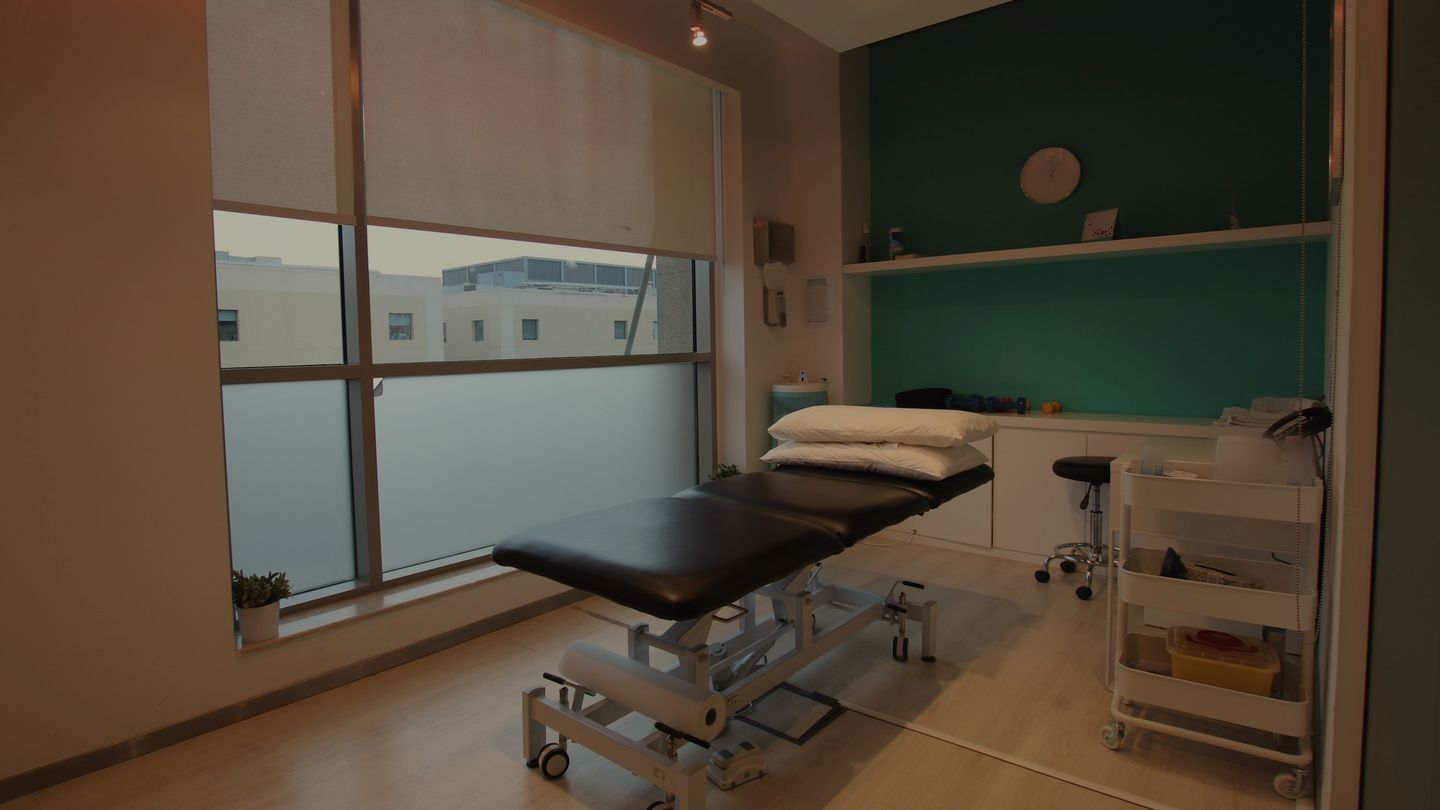 Illustrative image: an empty, calm treatment room at dusk